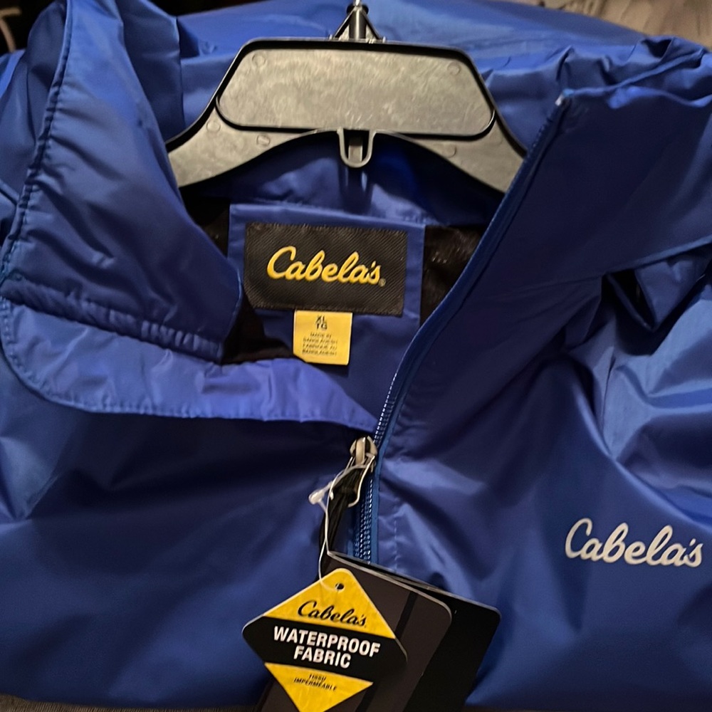 Cabela’s brand nautical blue rain jacket